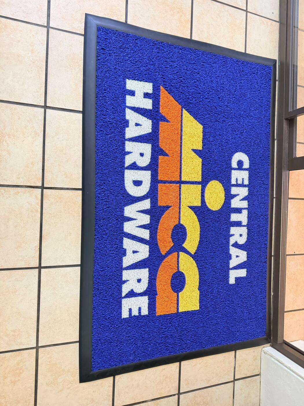 Blue outdoor coil mat with a logo
